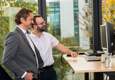 Collegues enjoying modernized application services from fecher